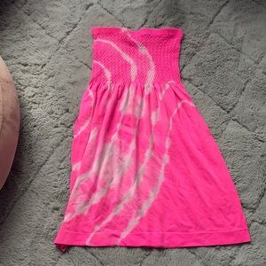 Bright pink and white swimsuit coverup for girls.